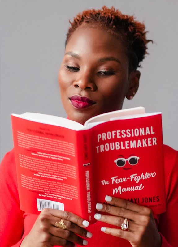 Luvvie Reading Professional Troublemaker Book